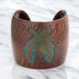Hammered metal crossed gun cuff bracelet