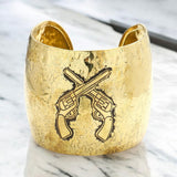 Hammered metal crossed gun cuff bracelet