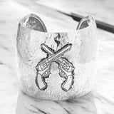 Hammered metal crossed gun cuff bracelet